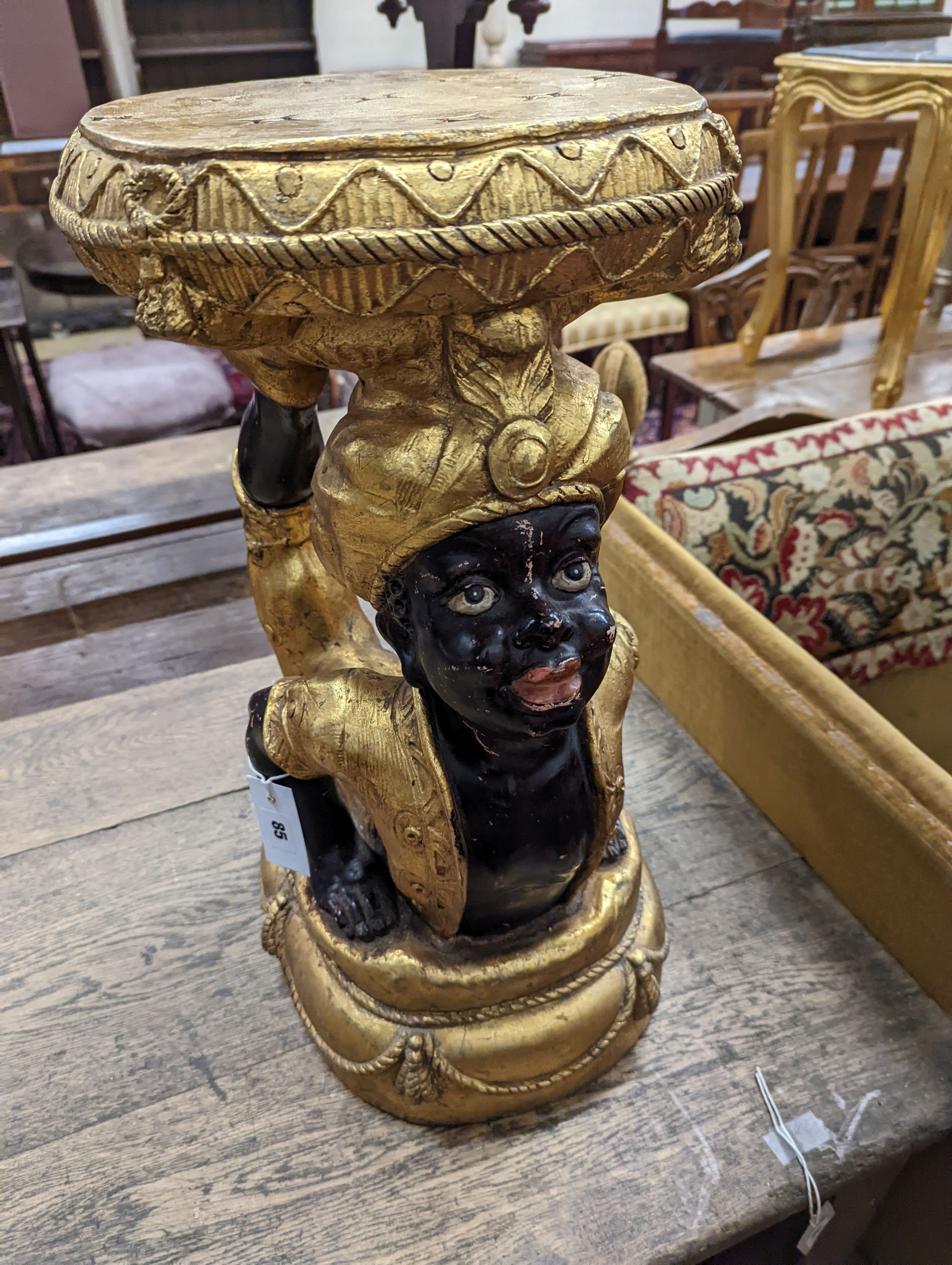 A Blackamoor stool. W-33cm, D-35cm, H-57cm.